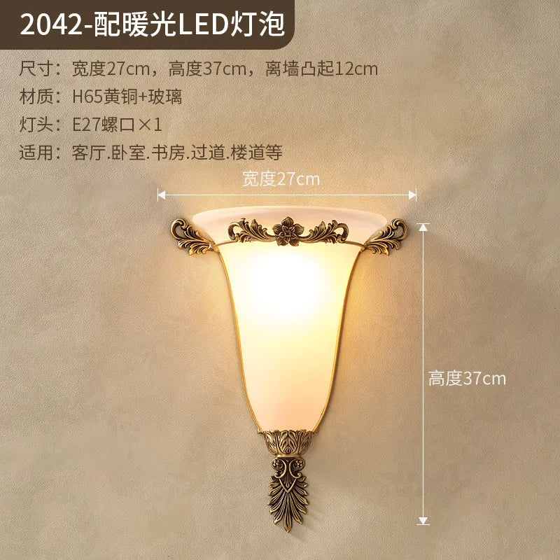 Retro gold wall sconce with glowing frosted glass shade and ornate centerpiece