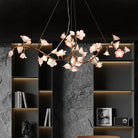 Ceramic flower chandelier with pink-white butterfly blossoms and gold metal ring frame