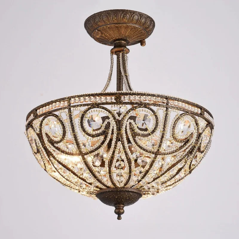 Gold-tone flush-mount chandelier close-up with crystal-style glass accents and intricate scrollwork