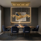 Ceiling-mounted pendant chandelier with gold glass leaf accents and multiple warm lights