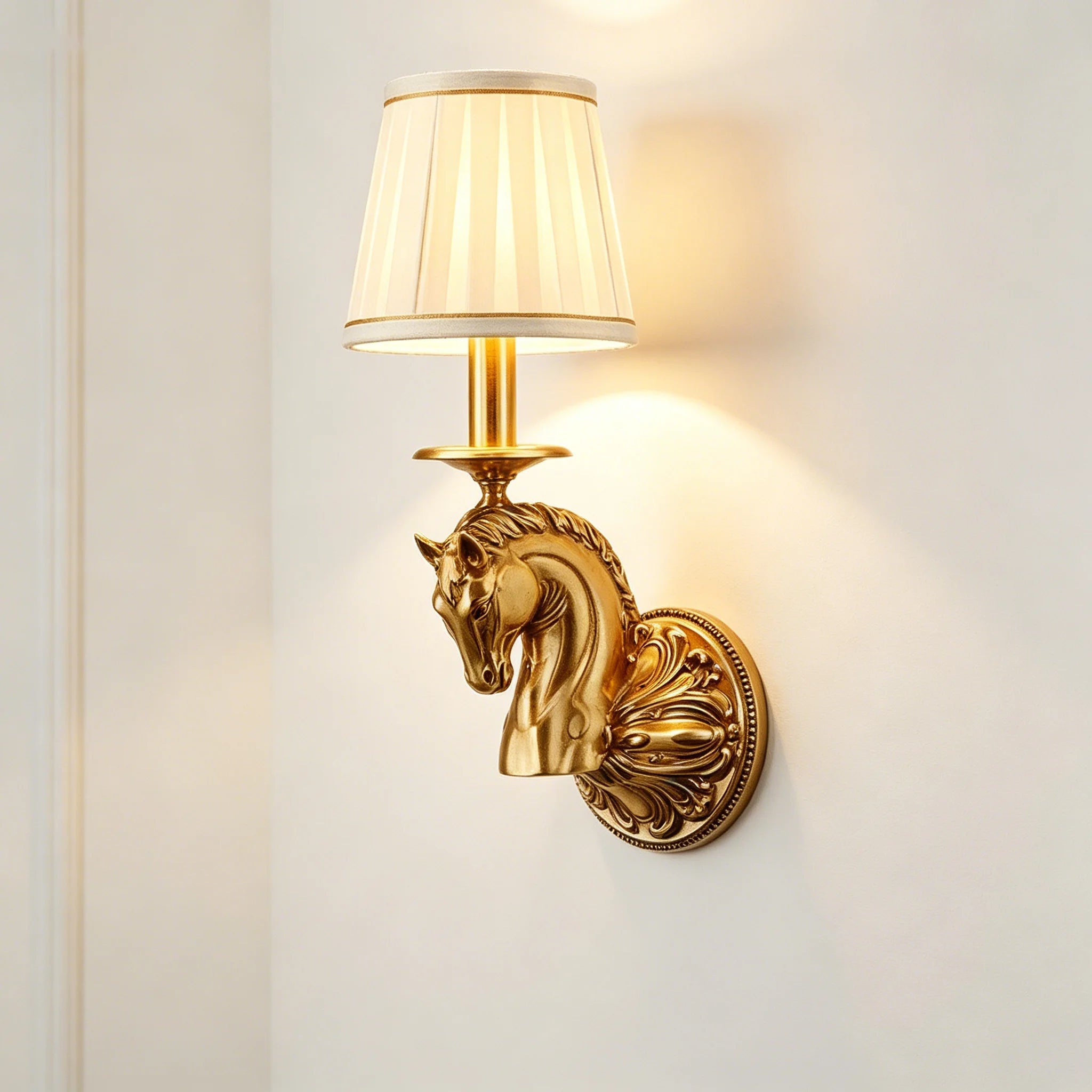 Decorative wall sconce featuring copper horse-head sculpture and beige drum lamp shade