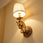 Decorative copper wall light with horse head relief and beige drum fabric shade