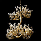 Hanging crystal chandelier with gold-toned tree-branch design and clear crystal prisms
